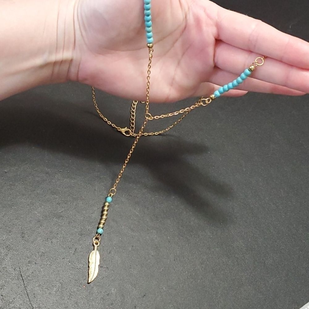 Gold tone feather turquoise necklace 26-28" Y style bead